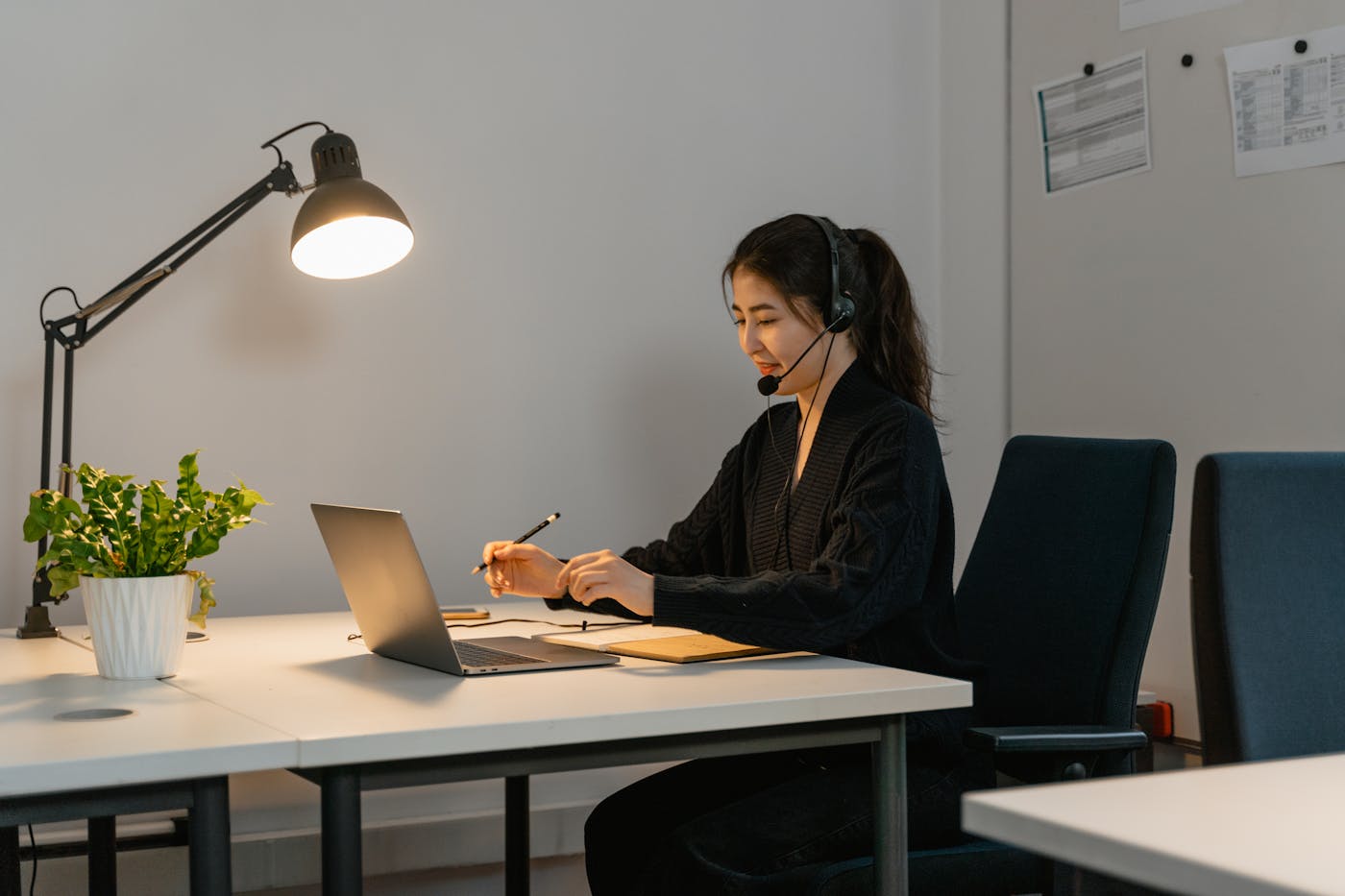 Support specialist helping customers from an office desk